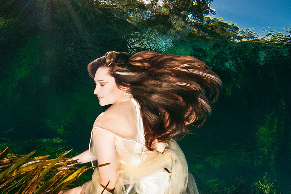 The underwater photographer Silvia Boccato interrogates the fluid universe from the underwater perspective, she creates a fashion and conceptual image in an upside-down world she makes a look at a world from below creating something deeper